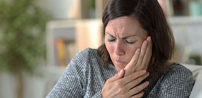 Patient suffering from Jaw Pain in need of chiropractor in Oakland